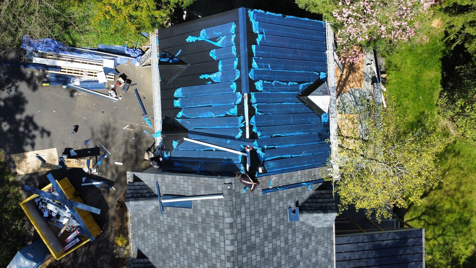 In-progress — standing seam metal panels being installed over new decking — Shelby Roofing Services PA