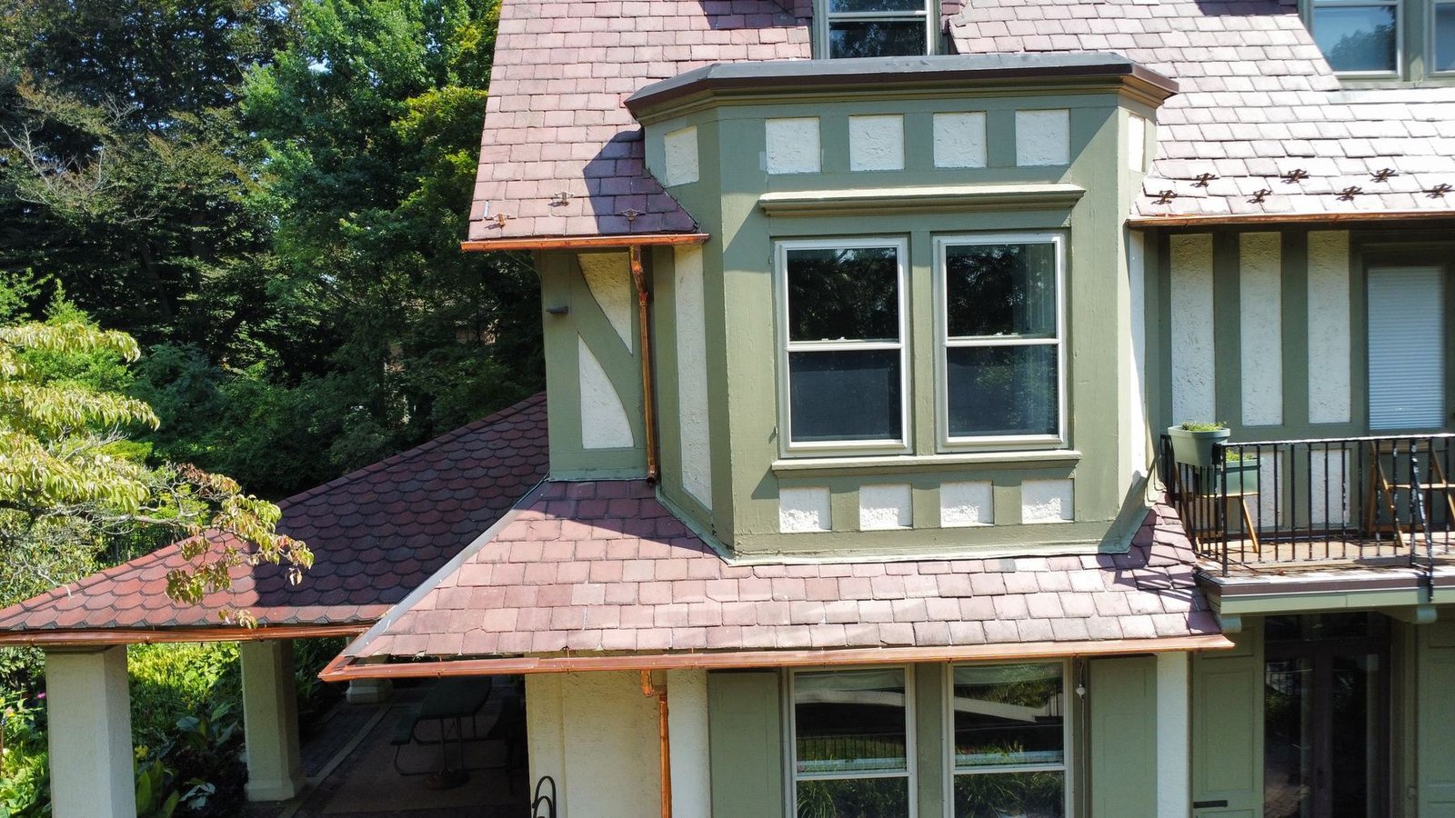 After — new copper gutter section on Tudor estate with slate tile roof — Shelby Roofing Services PA