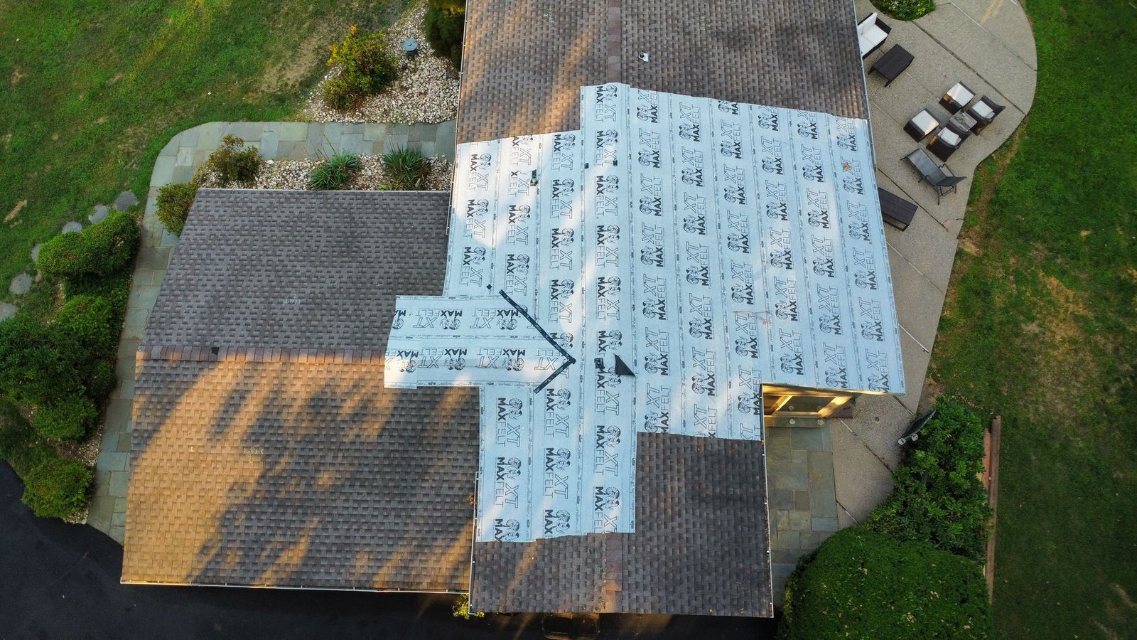 Before — close aerial with tarp and weather damage, PA