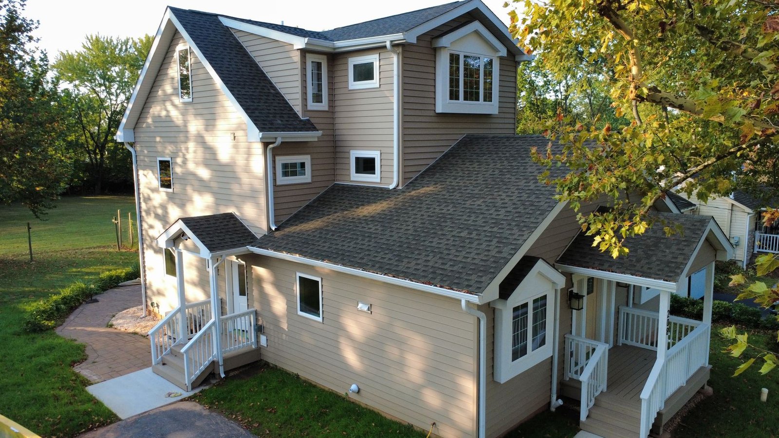 After — side aerial of expanded home — Shelby Roofing Services PA