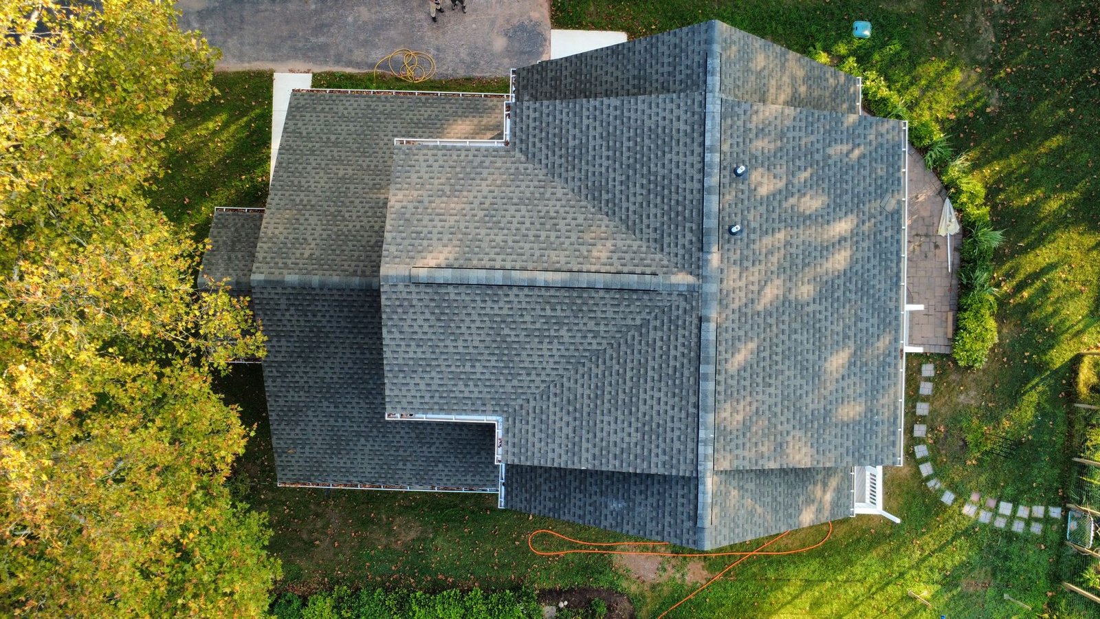 After — top-down aerial of completed new roof on expanded home — Shelby Roofing Services PA