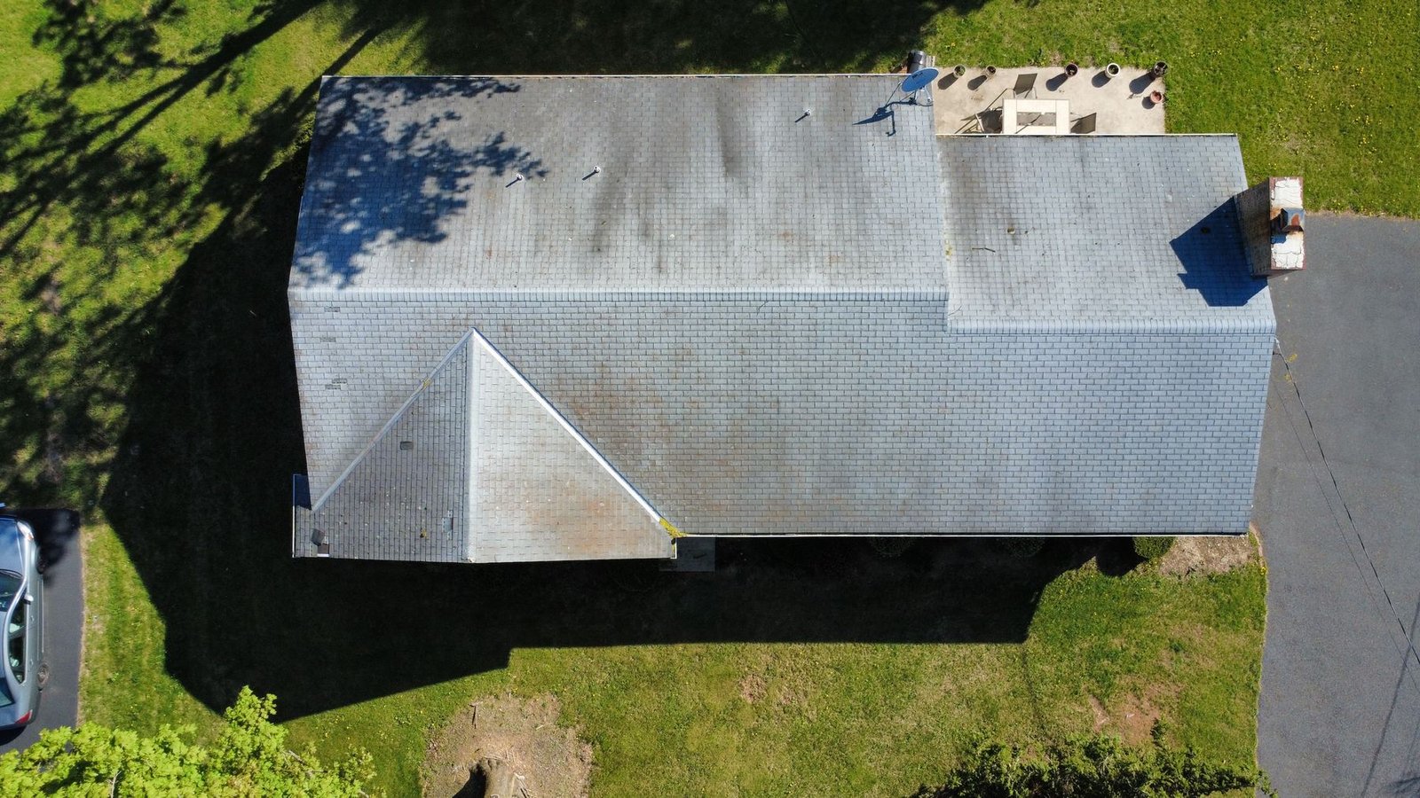 Before — angled aerial showing old shingle condition, PA