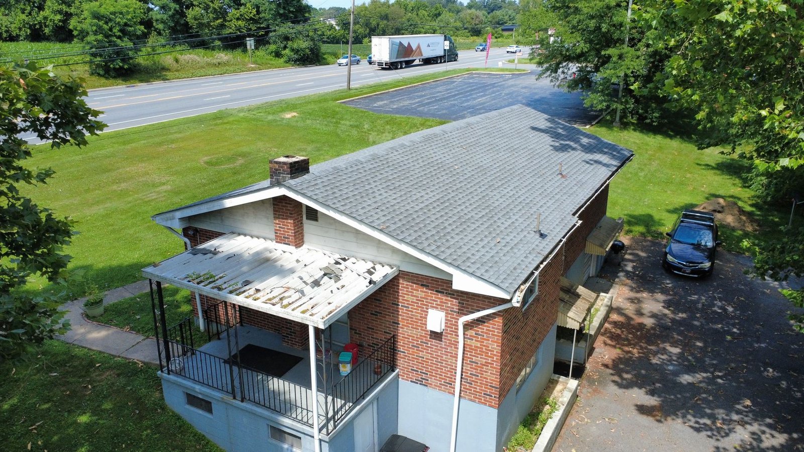 After — side aerial of brick ranch with new shingles — Shelby Roofing Services PA