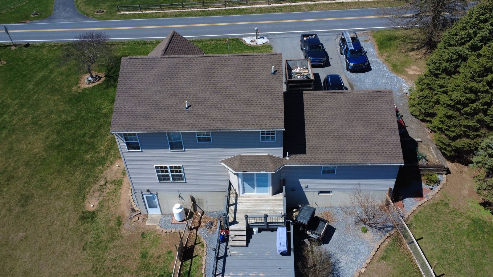 After — wide aerial of completed colonial farmhouse — Shelby Roofing Services PA
