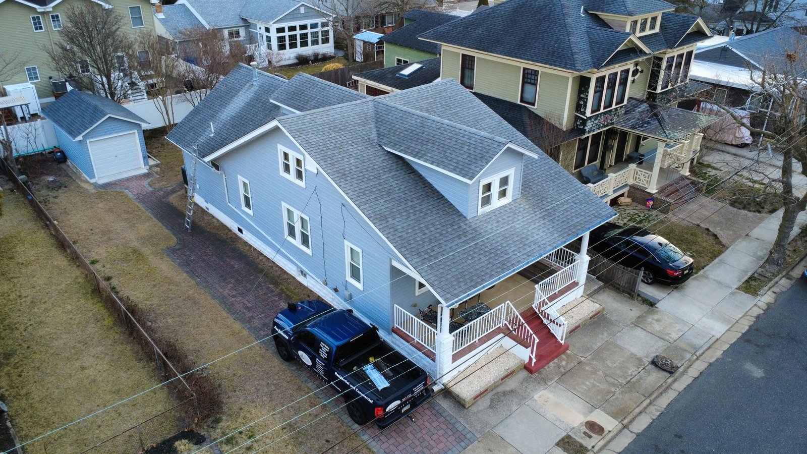 Before — top-down aerial of Cape Cod beach home with old gray shingles, NJ