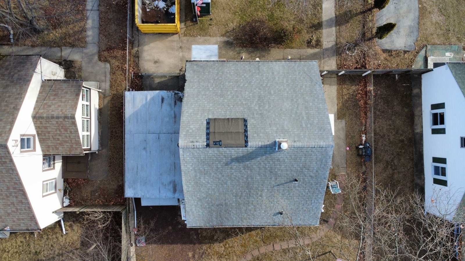 Before — top-down aerial of Cape Cod bungalow with old worn shingles, NJ