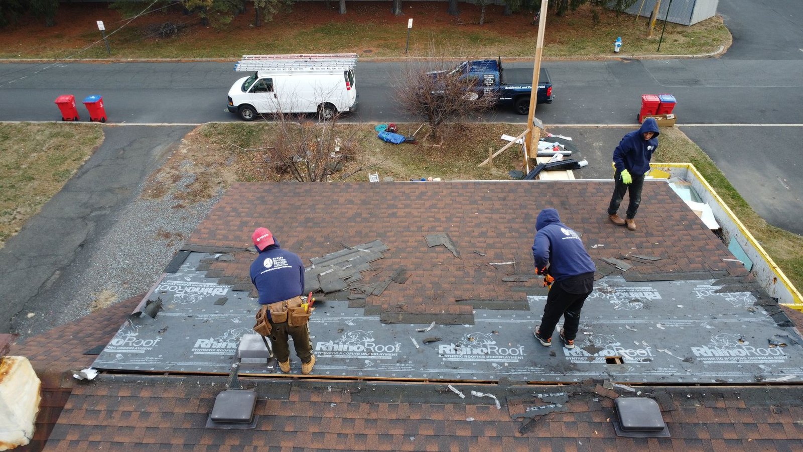 In-progress — Shelby crew tearing off old shingles on gambrel cape, NJ