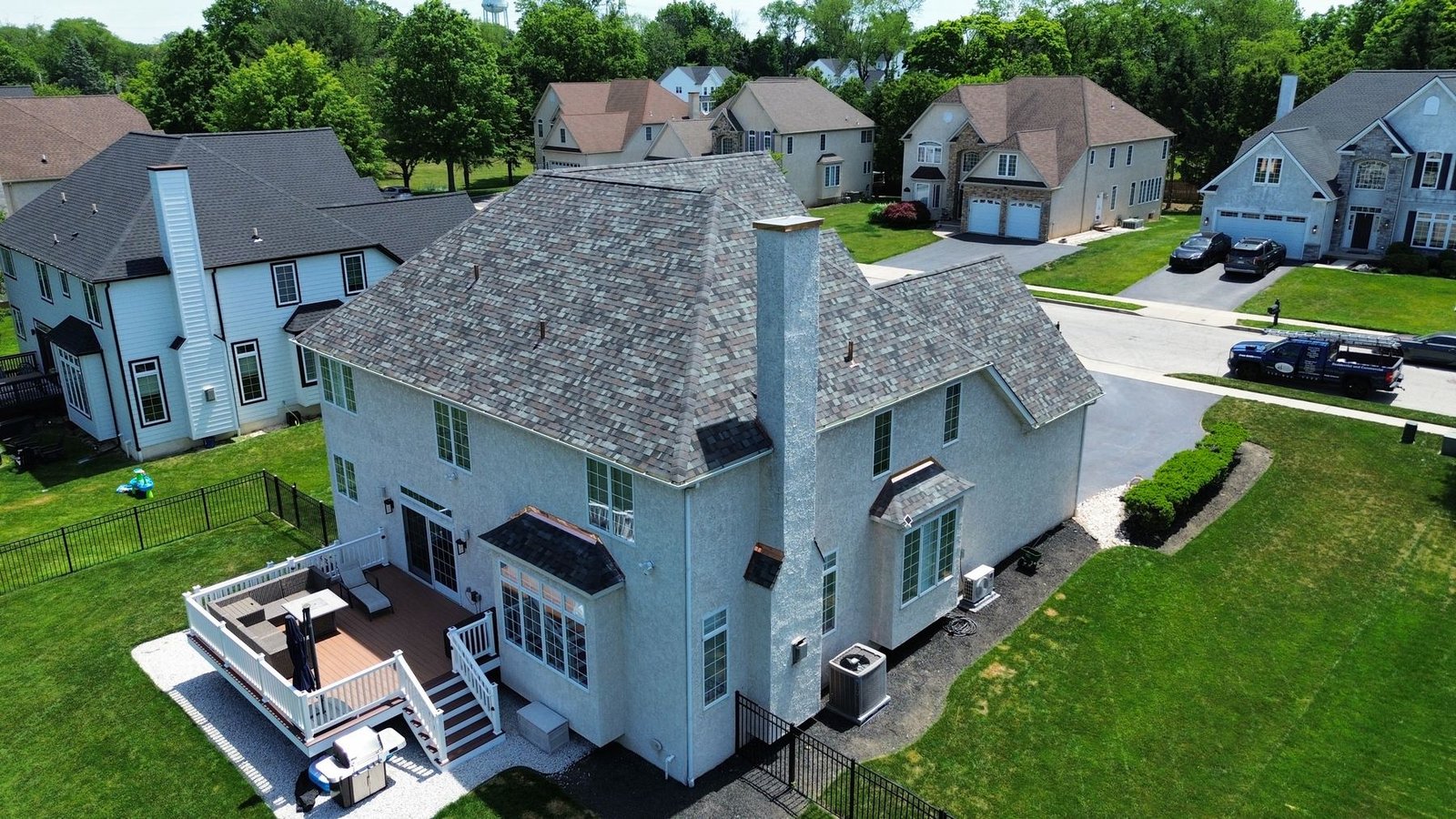 After — rear aerial view of completed shingle replacement with deck — Shelby Roofing Services PA