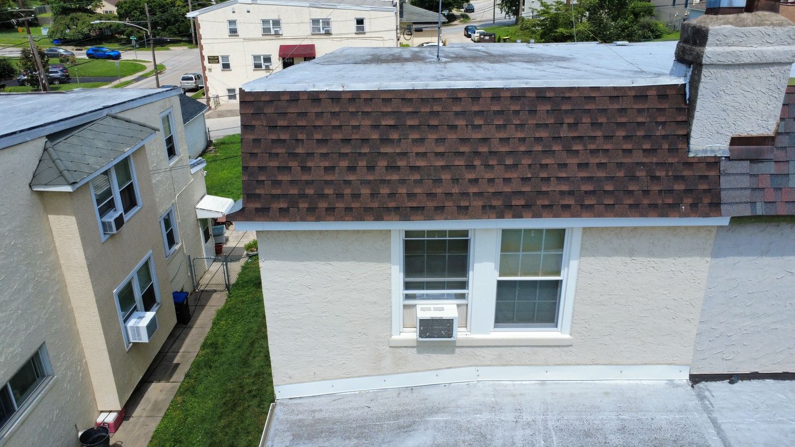 After — aerial of urban rowhouse with new brown architectural shingles — Shelby Roofing Services PA