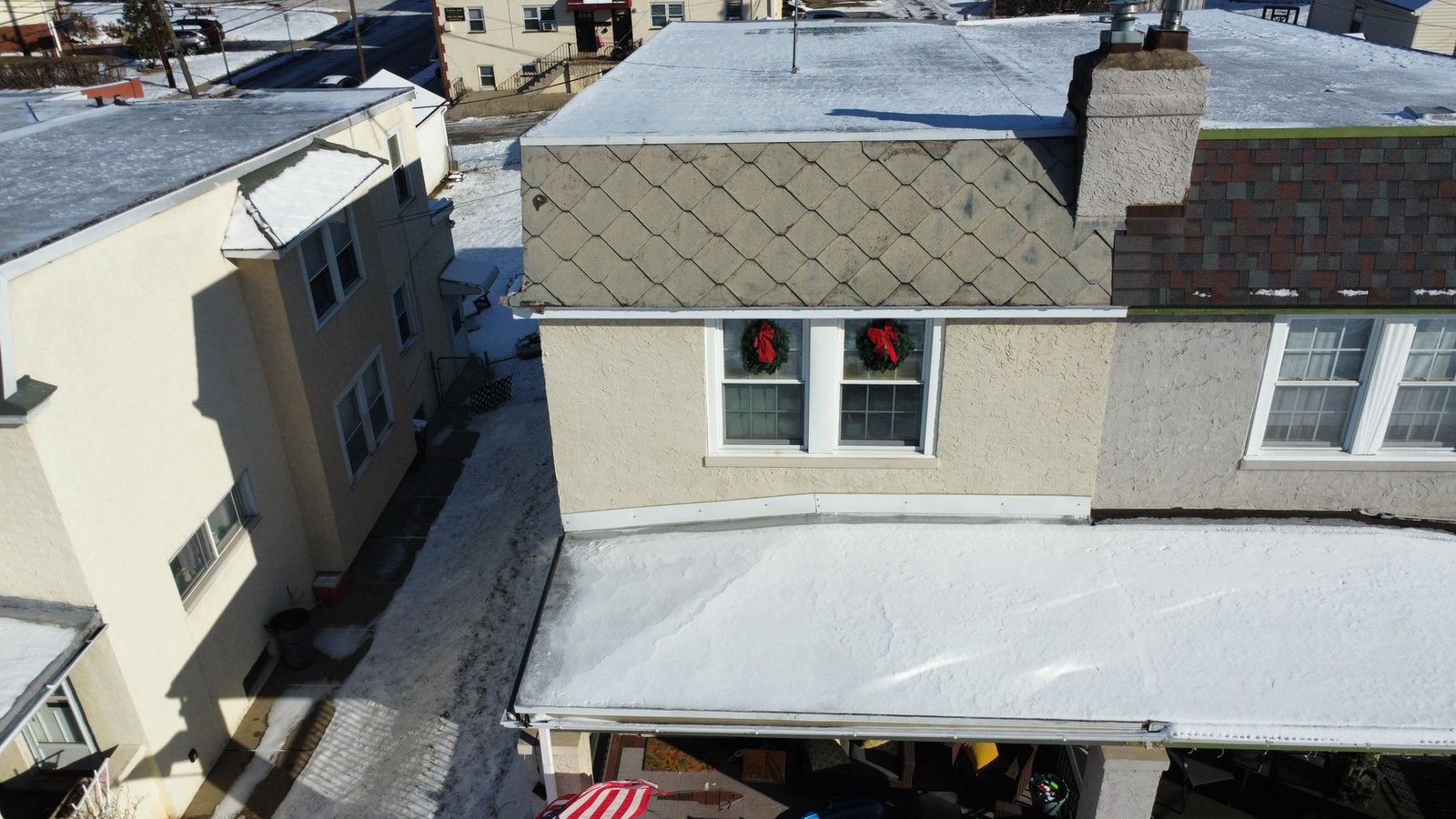 Before — aerial of urban rowhouse with old diamond-pattern shingles in winter, PA
