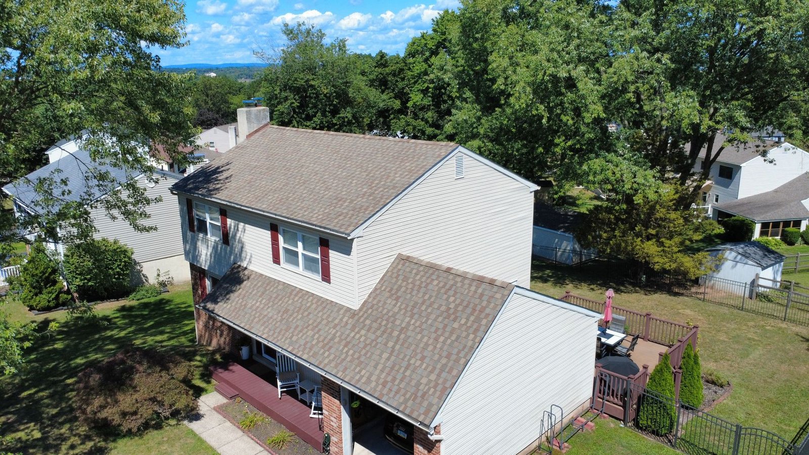 After — aerial of 2-story colonial with new brown architectural shingles — Shelby Roofing Services PA