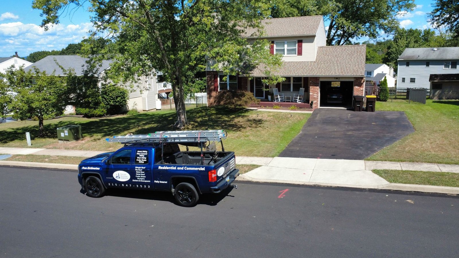 After — wide aerial of completed colonial property — Shelby Roofing Services PA