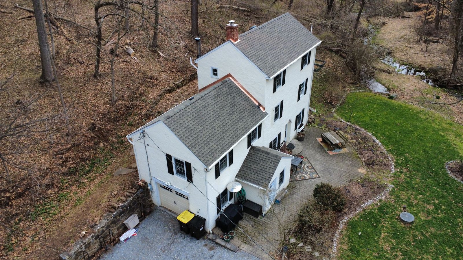 After — wide aerial of completed white cottage — Shelby Roofing Services PA