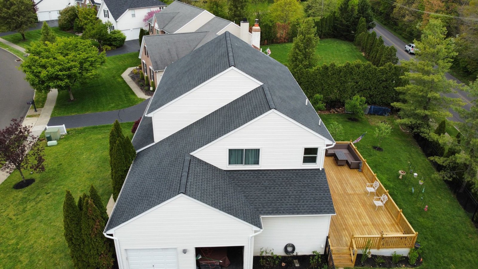 After — side aerial view with completed new charcoal shingle roof — Shelby Roofing Services PA