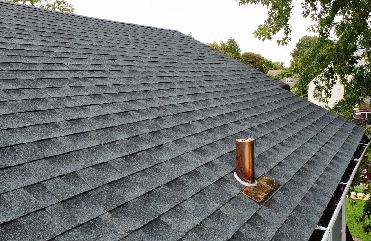 After — new charcoal shingles with copper pipe boot flashing — Shelby Roofing Services PA
