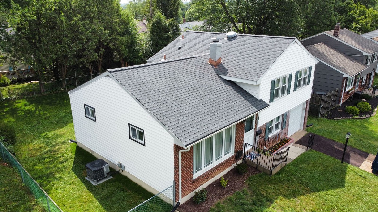 After — rear-left angle showing completed charcoal shingle roof — Shelby Roofing Services PA