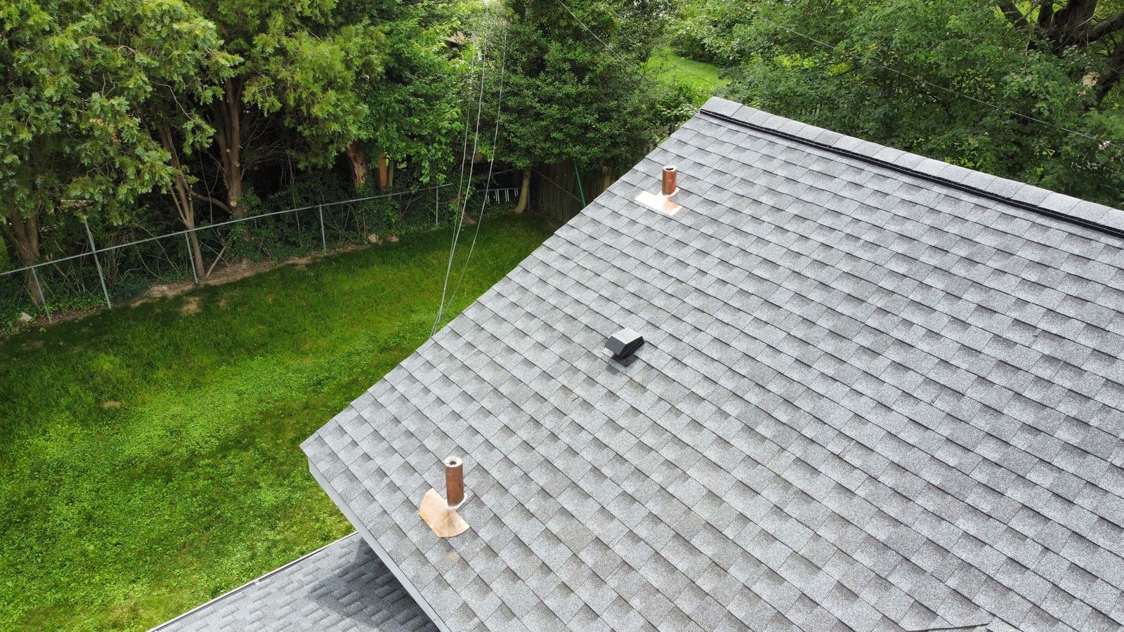 After — top-down view of rear roof section with new shingles and copper details — Shelby Roofing Services PA