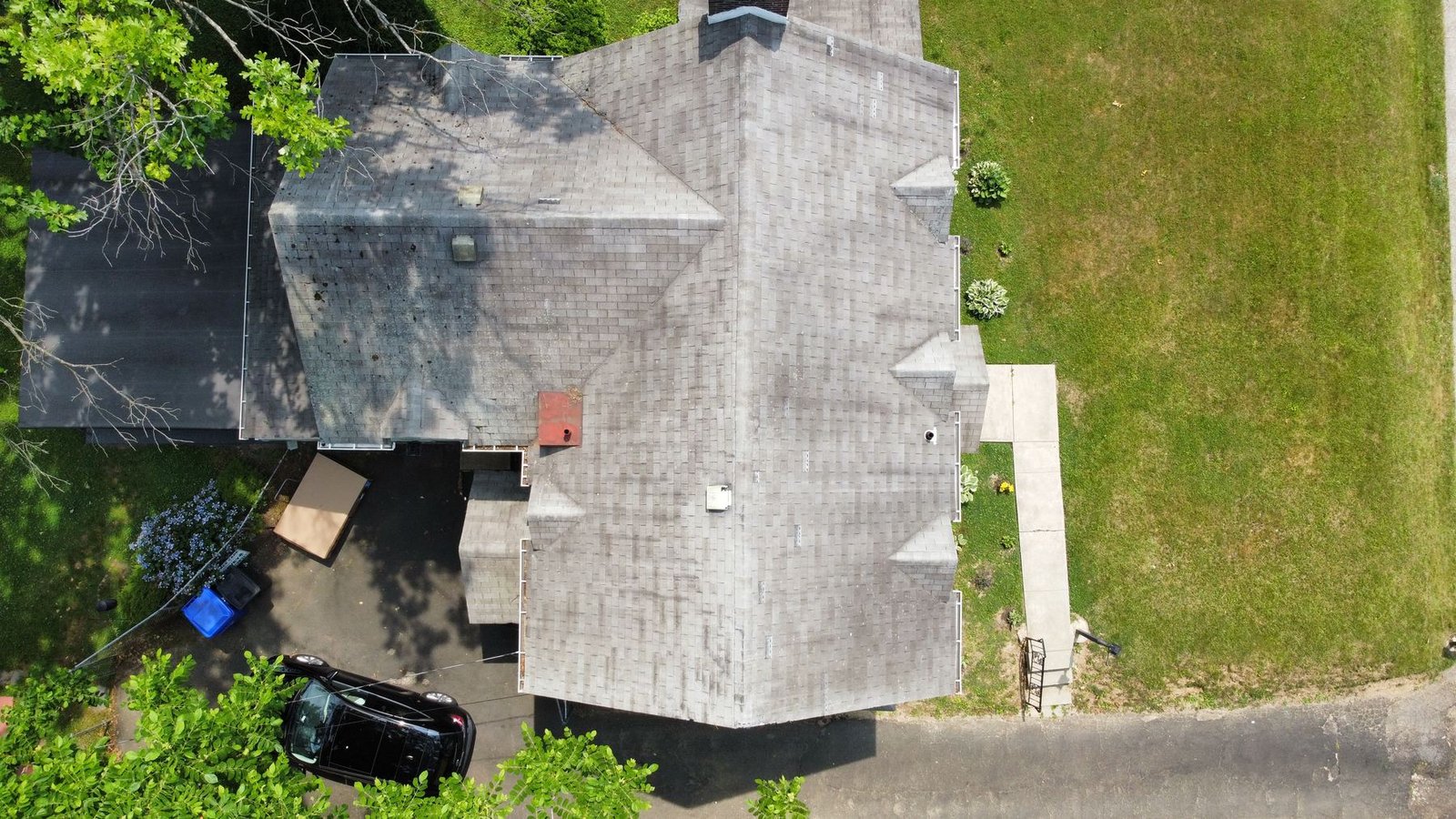 Before — straight top-down drone view showing full complex roof plan with old shingles, PA