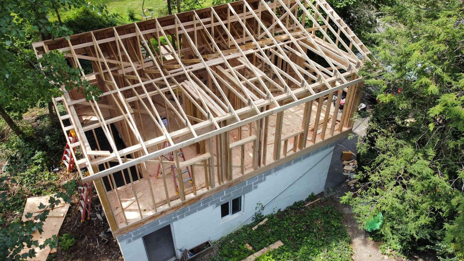 In-progress — aerial showing complete roof framing and open structure during new construction, PA