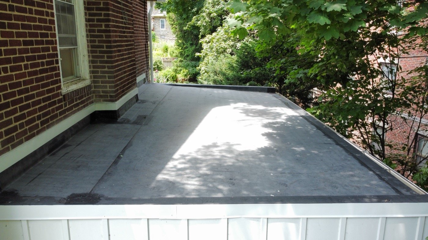 EPDM flat roofing system installation — single-ply rubber membrane by Shelby Roofing Services